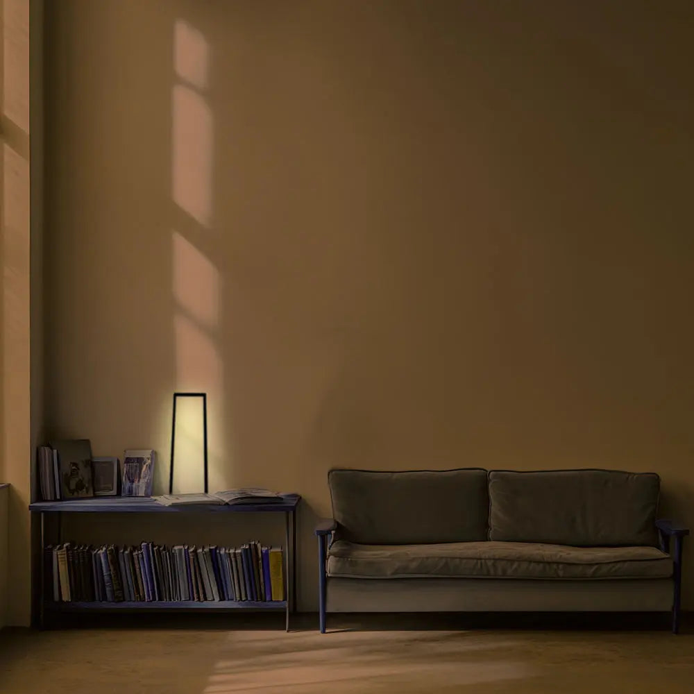 minimalist interior with indirect floor lamp creating soft shadows on wall