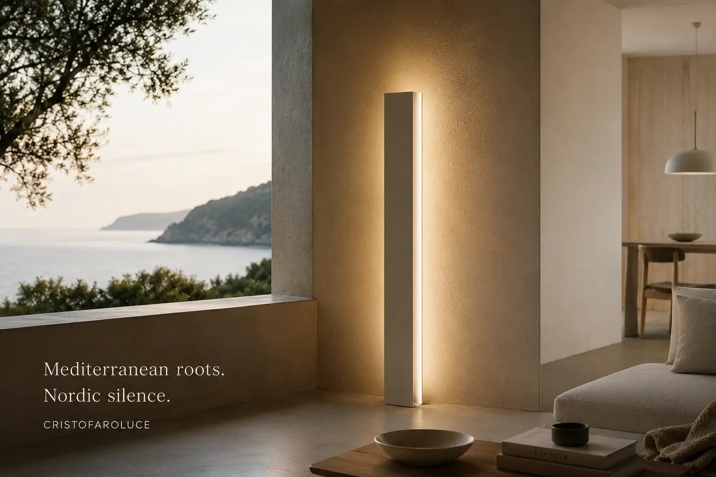 Minimalist handcrafted floor lamp by Tommaso Cristofaro casting warm indirect light in a Nordic-inspired interior with Mediterranean landscape and natural materials.