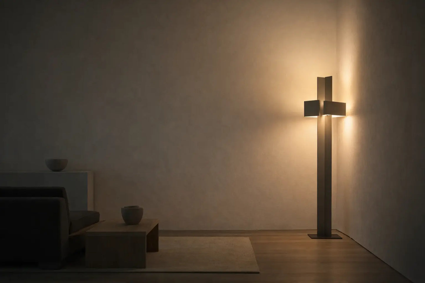 Minimalist interior with sculptural floor lamp and soft indirect light shaping a calm atmospheric space