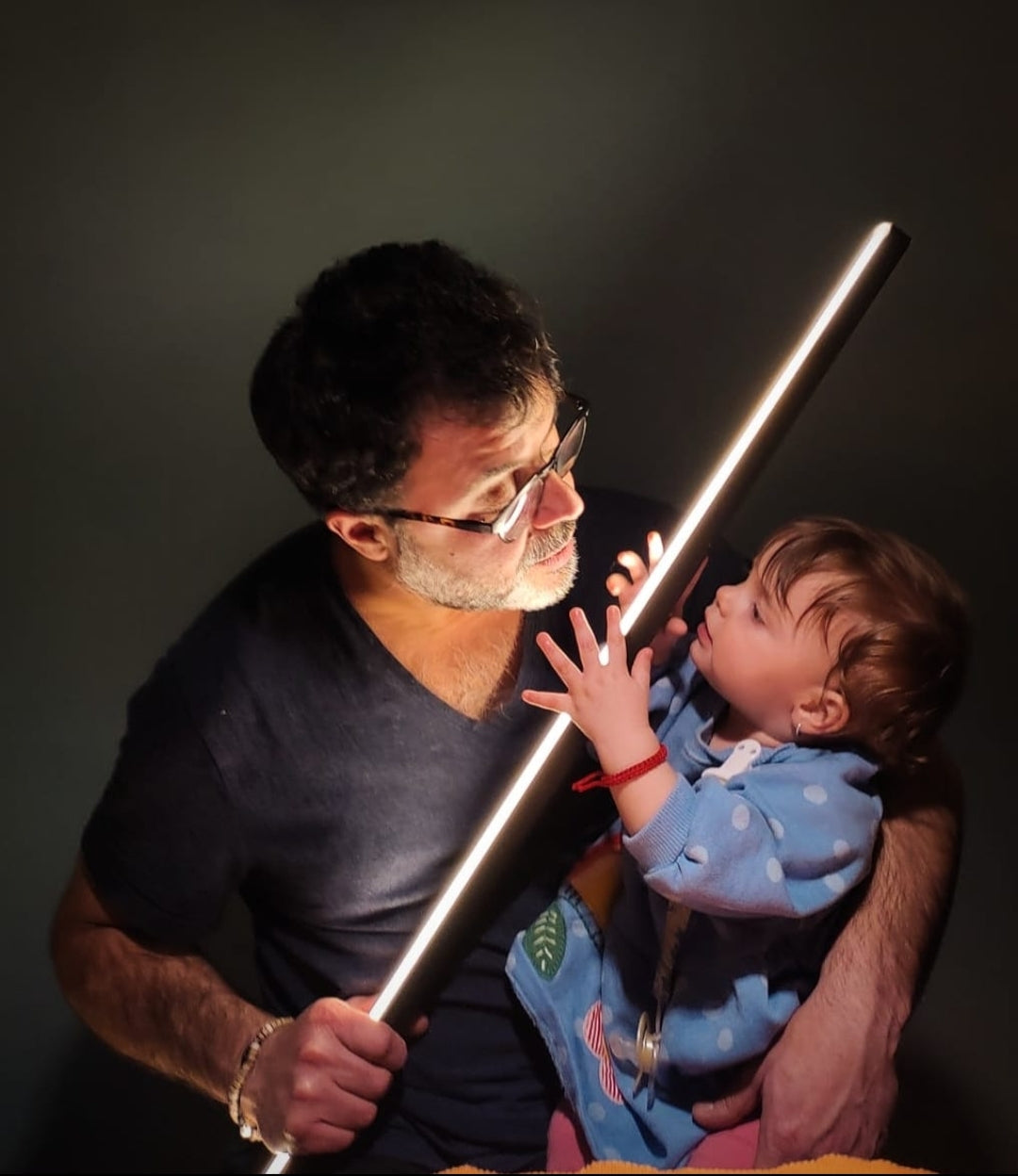 Italian light artist Tommaso Cristofaro with his daughter Carolina, symbol of the future of CristofaroLuce