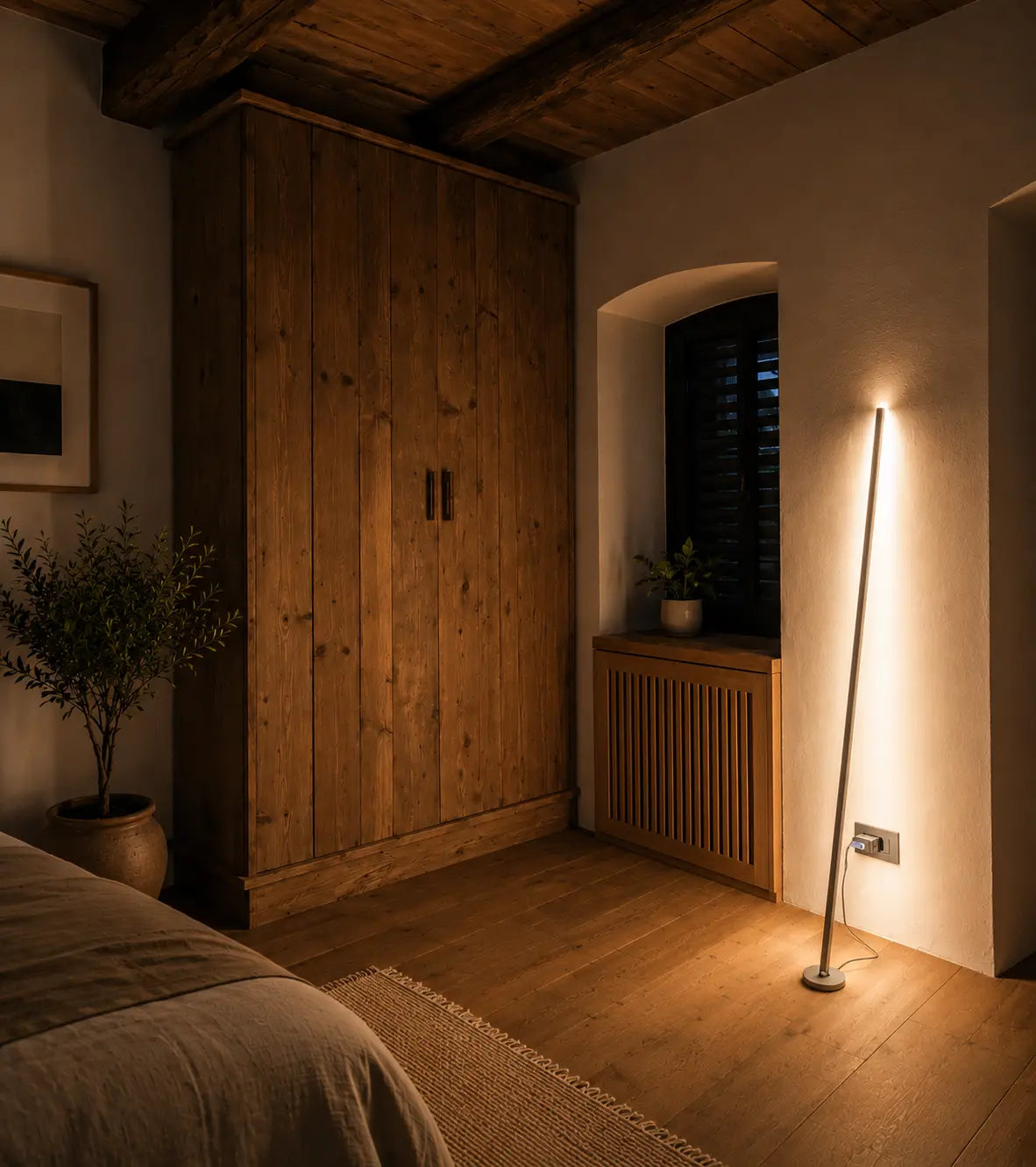 Gica Contra Floor Lamp 150 standing near a wall, showing its slim sculptural form and warm indirect light in a contemporary interior