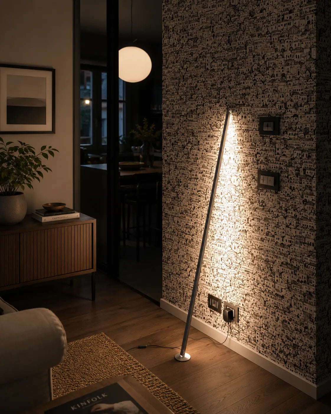 Gica Contra Floor Lamp 150 creating a warm indirect glow beside a wall as part of a daily lighting rhythm