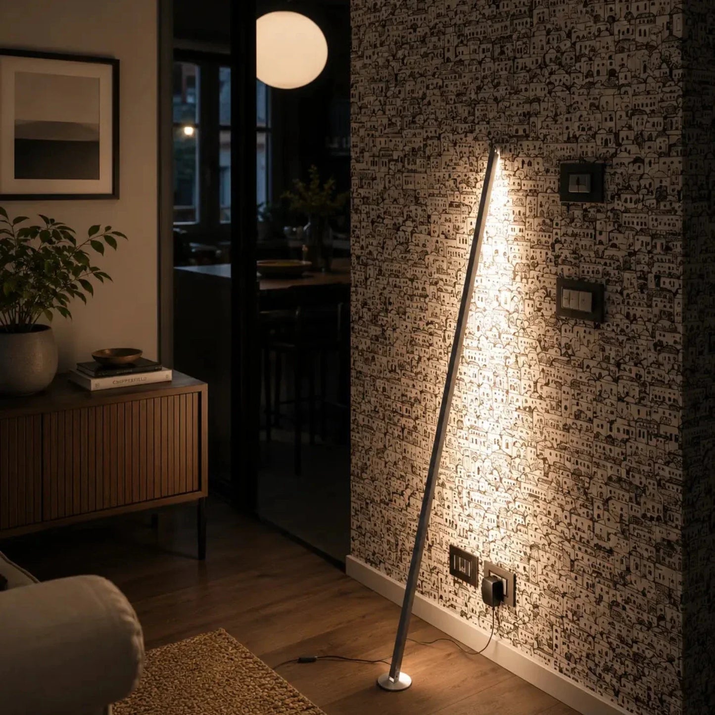Gica Contra sculptural floor lamp creating a single warm vertical line in a refined contemporary interior.