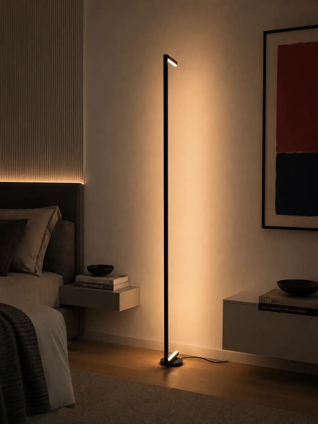 Tratto Floor Lamp by Tommaso Cristofaro beside a wall, creating a thin architectural line of warm reflected light.