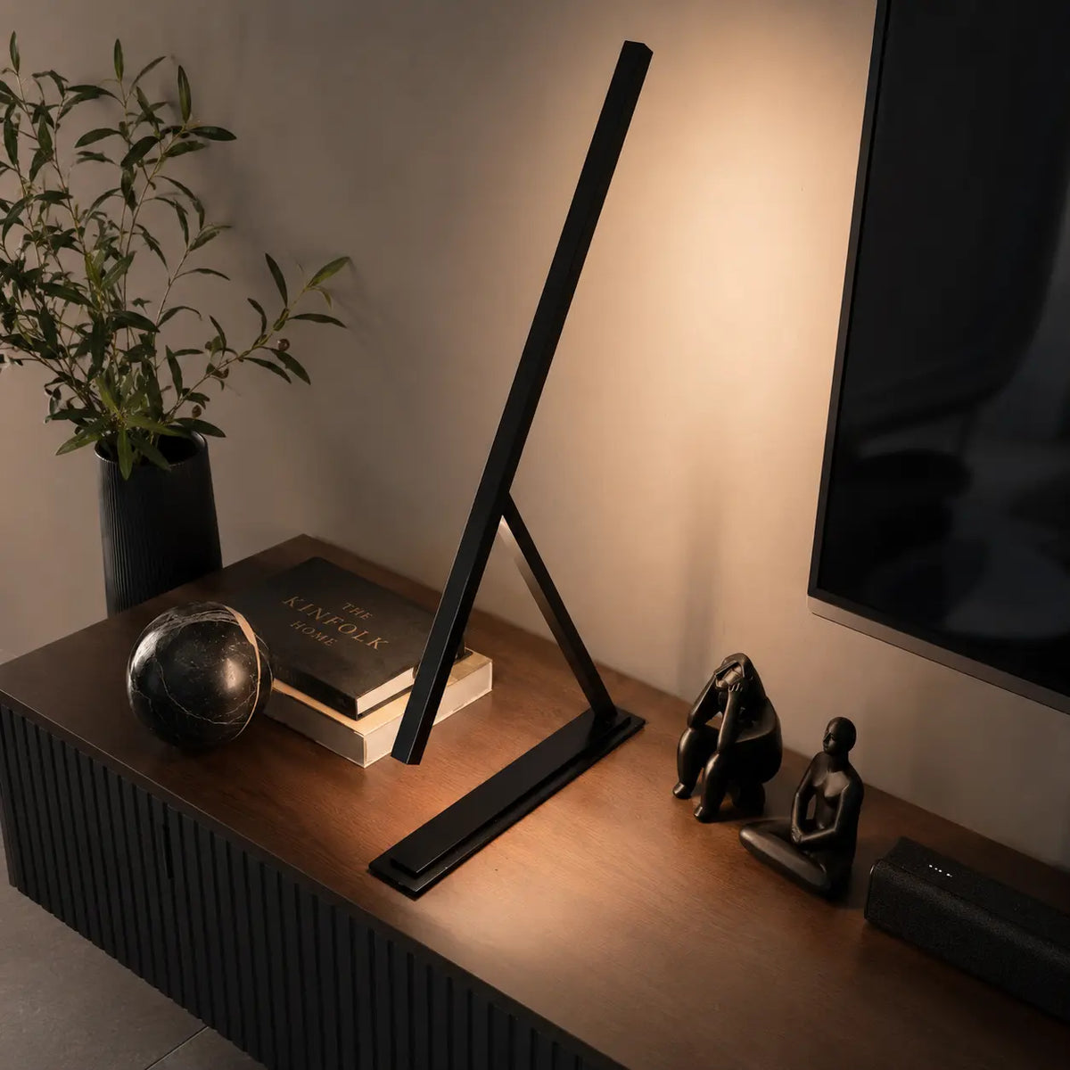 Colorful handmade Achille table lamps by Tommaso Cristofaro, minimalist sculptural lighting in red, blue, yellow and dark grey with natural cork base.