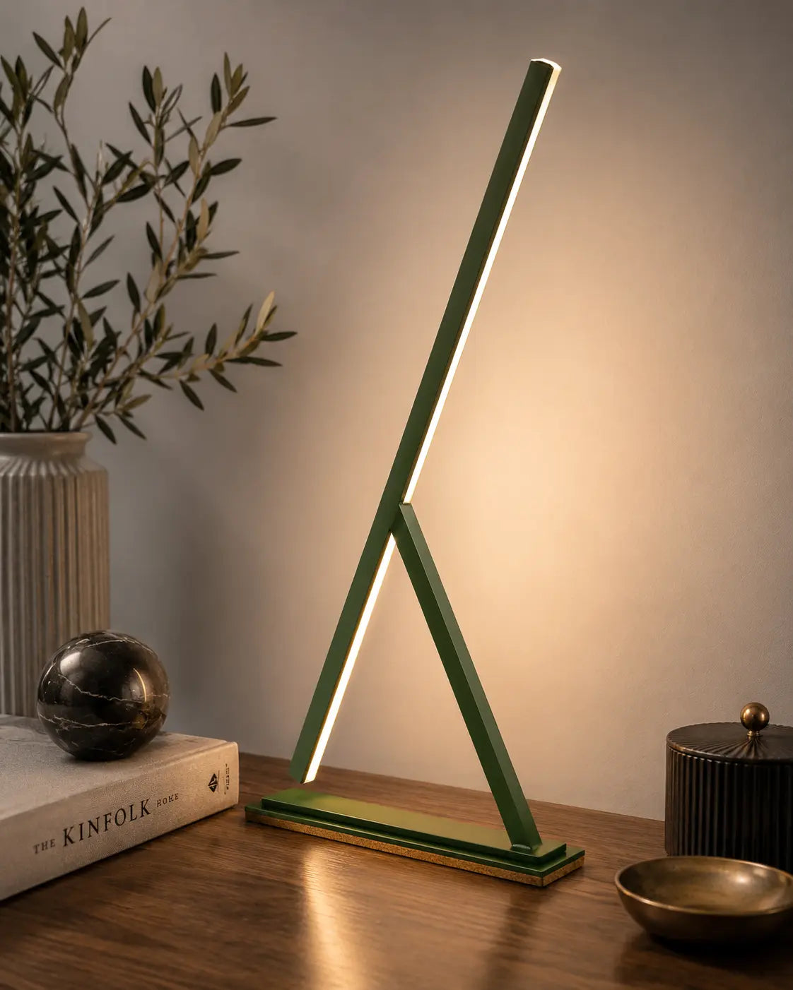 Colorful handmade Achille table lamps by Tommaso Cristofaro, minimalist sculptural lighting in red, blue, yellow and dark grey with natural cork base.