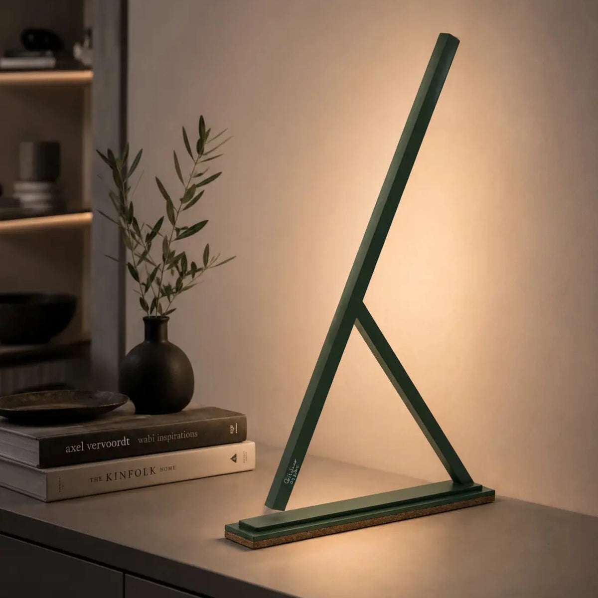 Colorful handmade Achille table lamps by Tommaso Cristofaro, minimalist sculptural lighting in red, blue, yellow and dark grey with natural cork base.