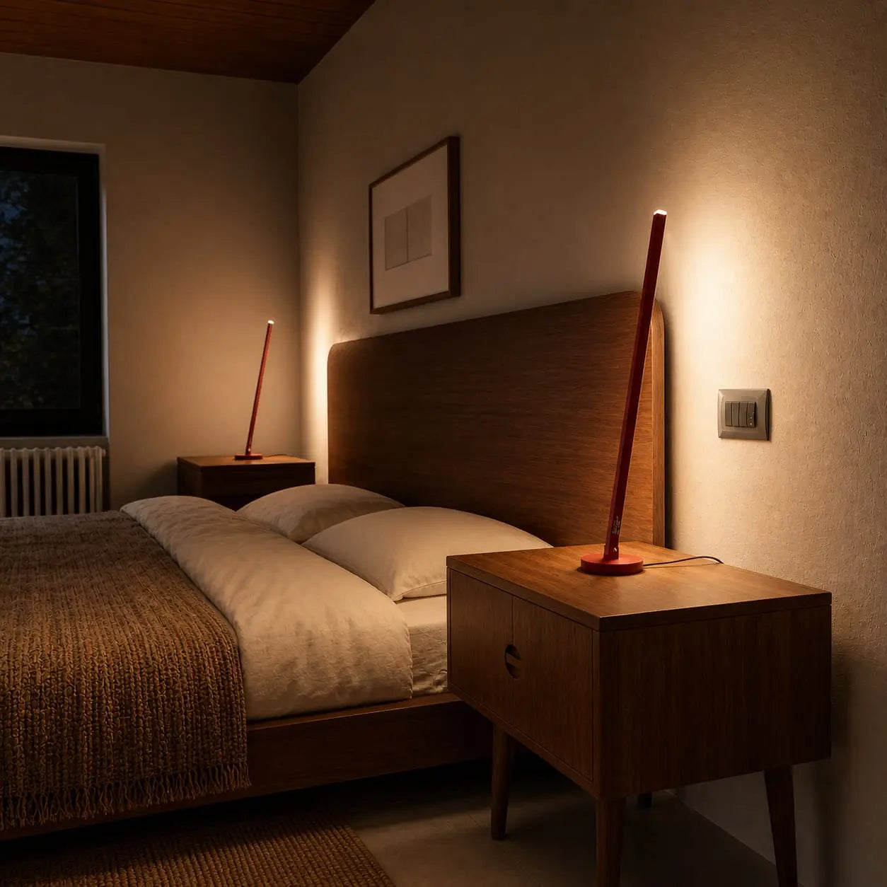 Handcrafted Gica Contra Table Lamp on a wooden bedside table, creating warm indirect light in a refined bedroom interior.