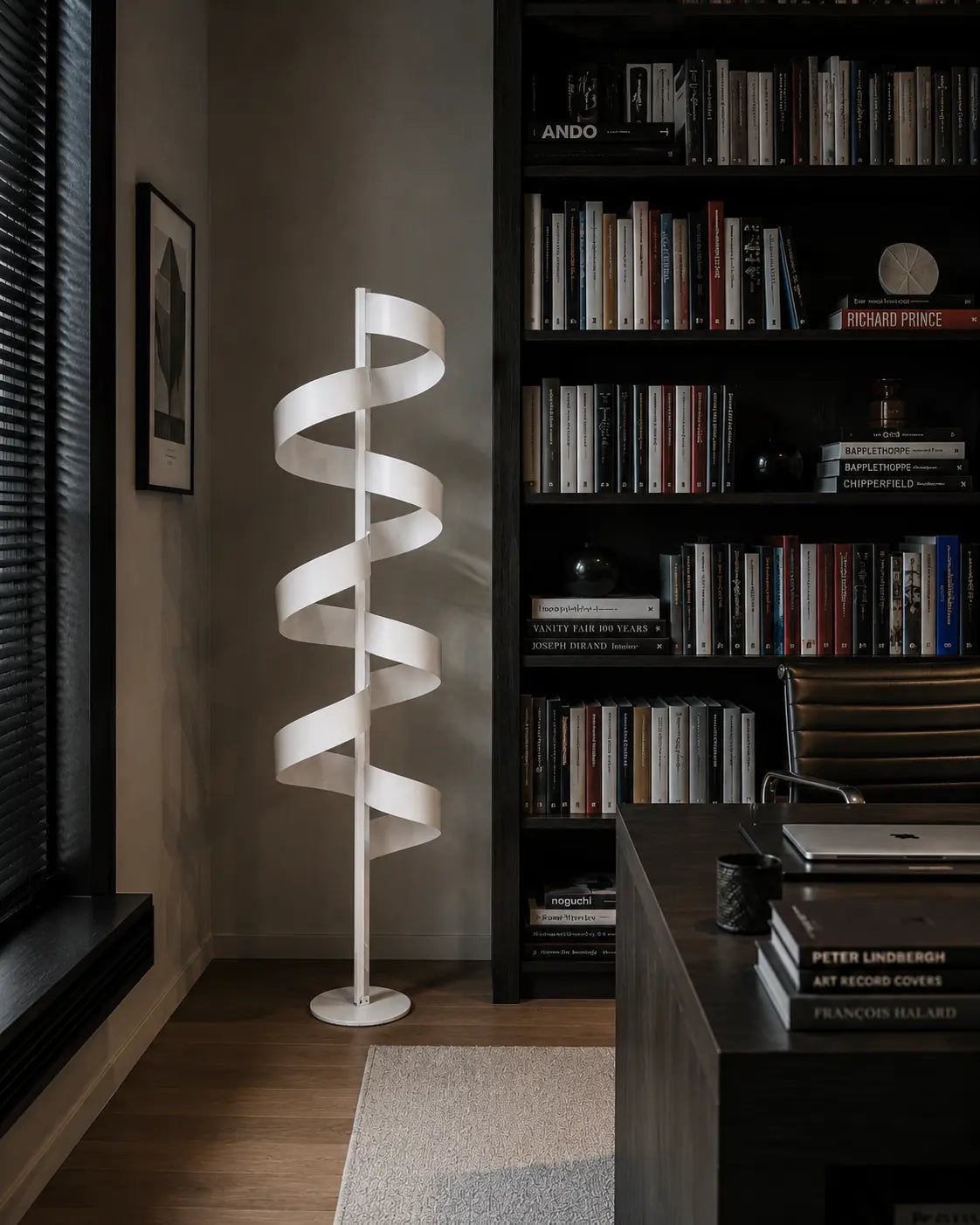Aura Floor Lamp by Tommaso Cristofaro, handmade white sculptural floor lamp with spiral form and warm indirect light, photographed in a refined contemporary interior.