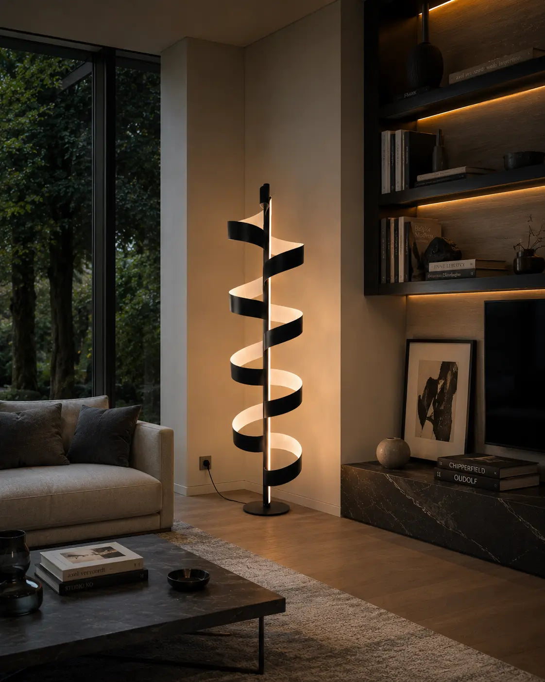 Aura Floor Lamp in matte black with white interior, sculptural spiral floor lamp photographed on a neutral grey studio background