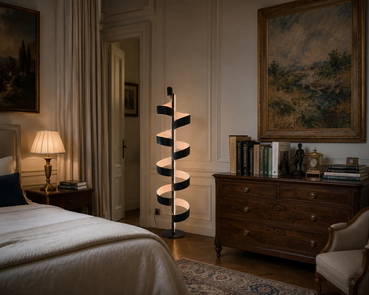 Aura Floor Lamp in matte black with white interior, sculptural spiral floor lamp photographed on a neutral grey studio background