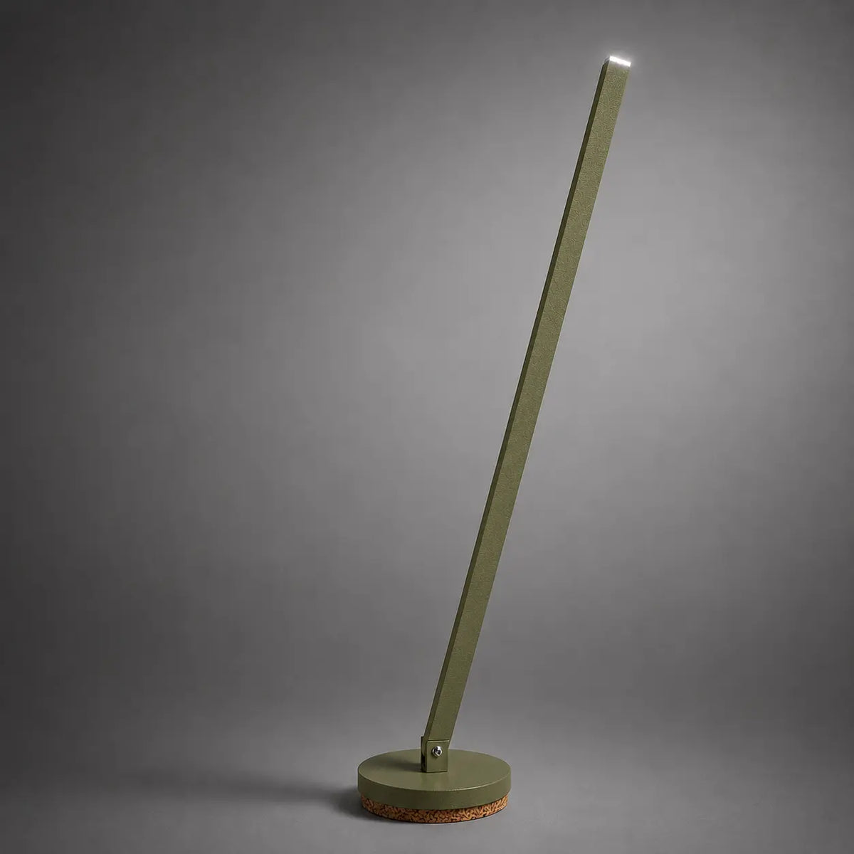 Gica table lamp by Tommaso Cristofaro, sculptural handmade lamp in green olive matte sandblasted finish on a neutral gray studio background