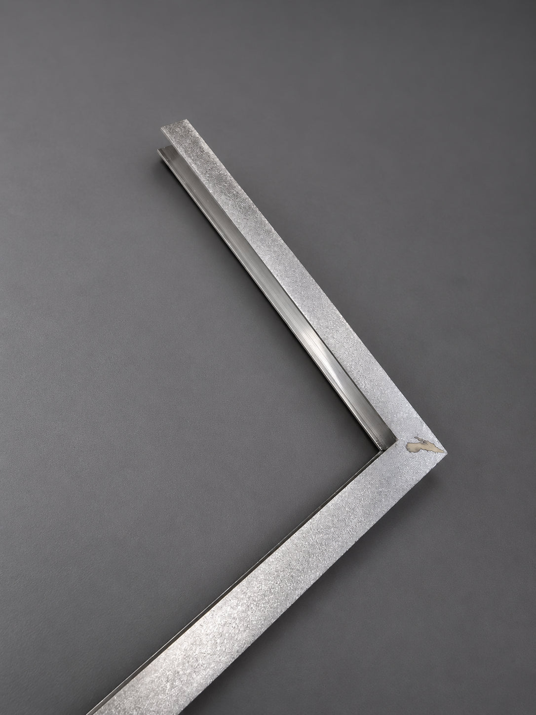 Hand-finished structural detail of the Tratto Slim Floor Lamp in the CristofaroLuce atelier