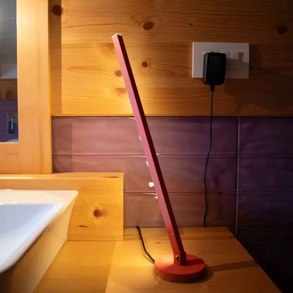Gica Contra Table Lamp in Red – Minimalist handmade desk light with indirect wall glow designed by Tommaso Cristofaro
